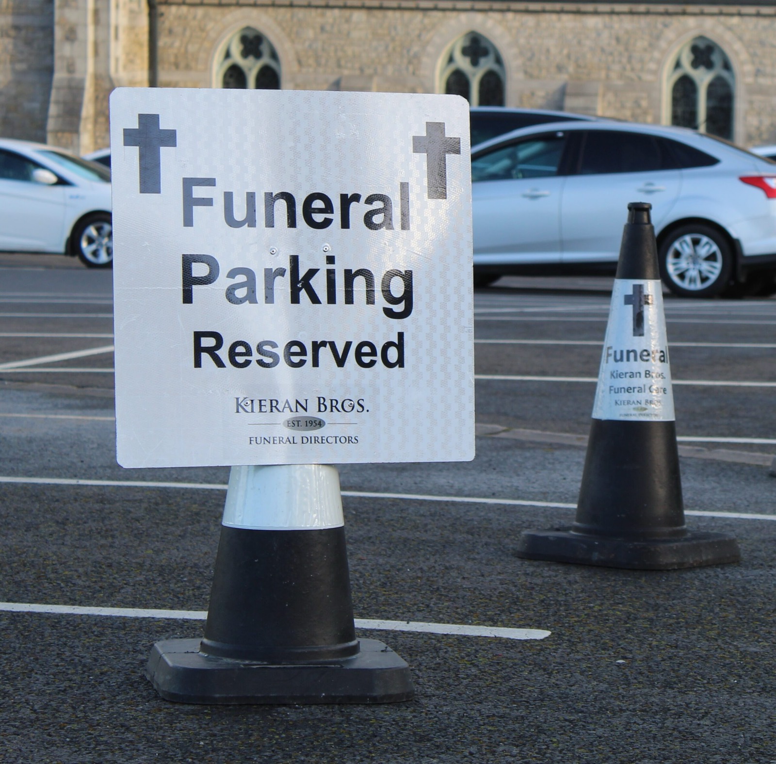 Cone-mounted funeral sign
